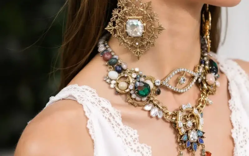 "Layered necklaces and bracelets paired with vintage and modern jewelry."